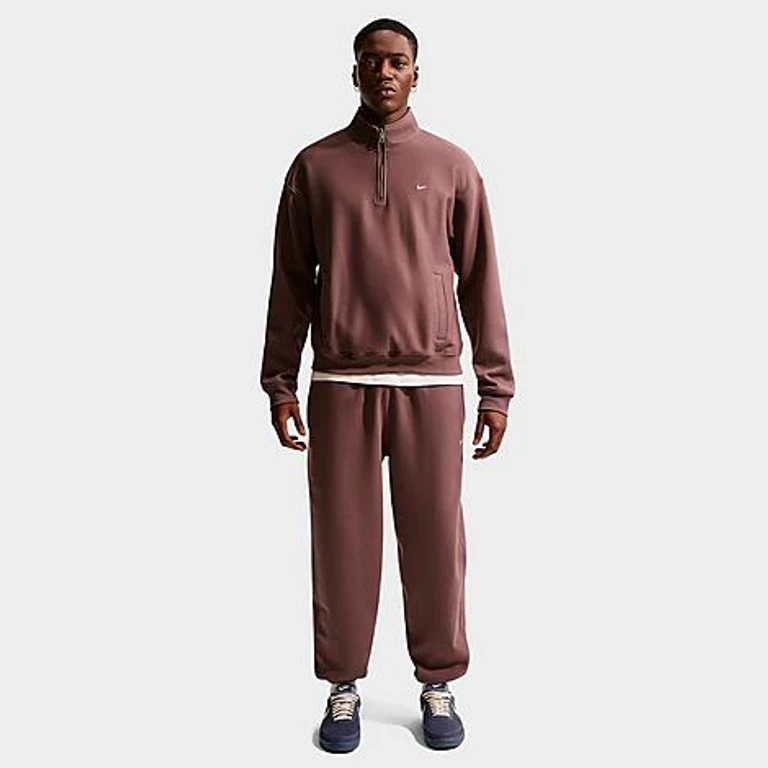 Nike Men's Solo Swoosh Cuffed Fleece Pants in Tattoo/White Size: XS