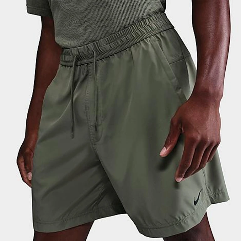Nike Men's Form Dri-FIT Unlined 7" Versatile Shorts in Rush Pink/Black Size: XS