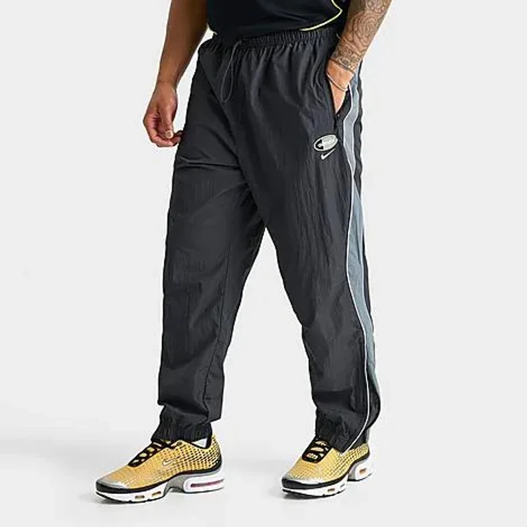 Nike Men's Sportswear Air Max 95 Woven Pants in Anthracite/Cool Grey/Neon Yellow Size: Small