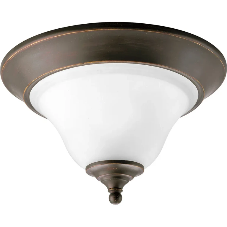 Antique Bronze One Light Flush Mount from the Trinity Collection