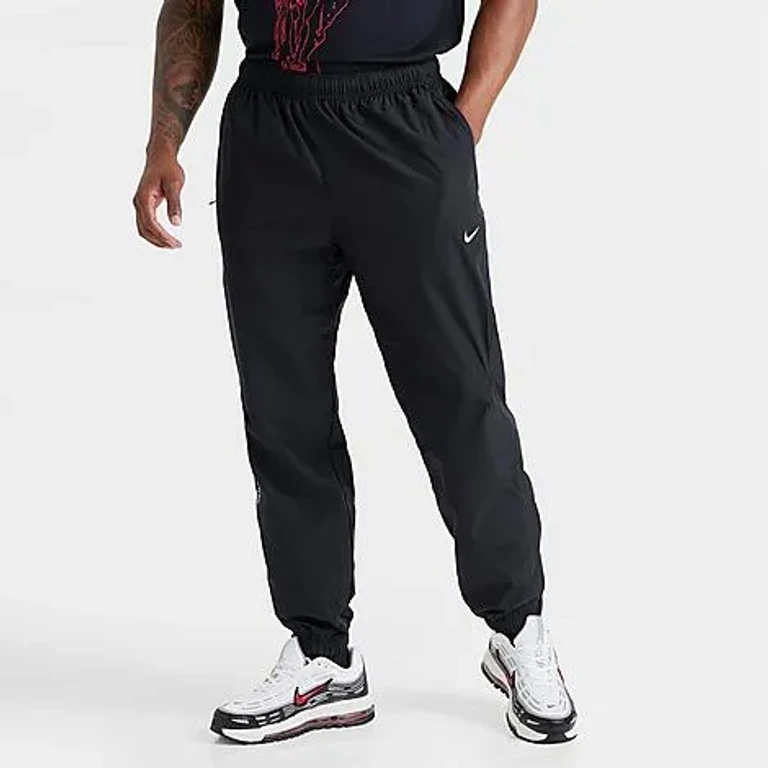 Nike NOCTA Northstar Nylon Track Pants in Neptune Green/Neptune Green/Black Size: Small