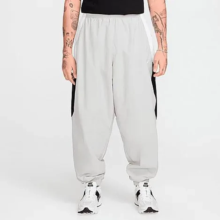 Nike Men's Club Oversized Woven Track Pants in Light Smoke Grey/White/Black Size: XS