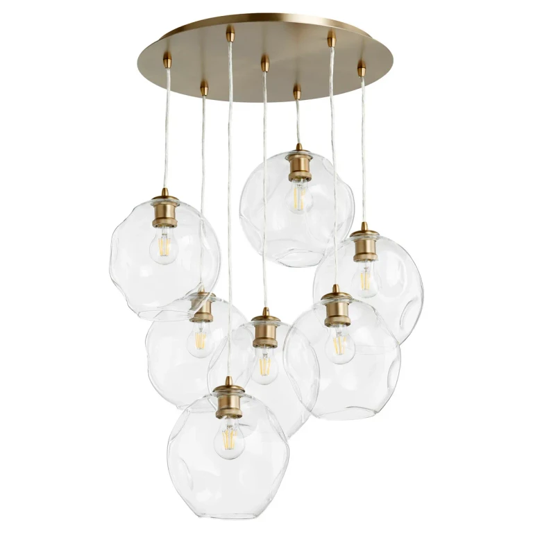 Aged Brass Seven Light Pendant from the Numen Collection