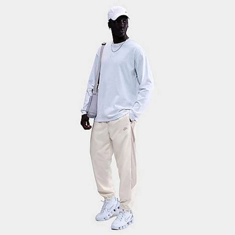 Nike Men's Windrunner Lined Pants in Sail/Court Blue/Court Blue Size: Small