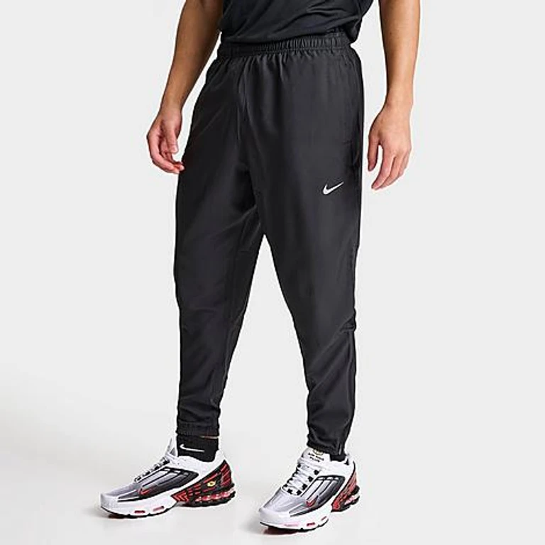 Nike Men's Challenger Dri-FIT Woven Running Pants in Black/Reflective Silver Size: Small