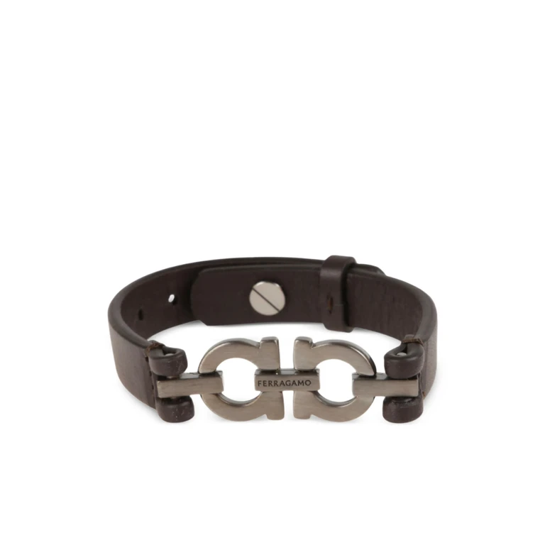Bracciale Ferragamo. Design In Pelle, Decorato Con Doppio Logo Gancini In Finitura Rutenio. Chiusura Regolabile Con Perno.