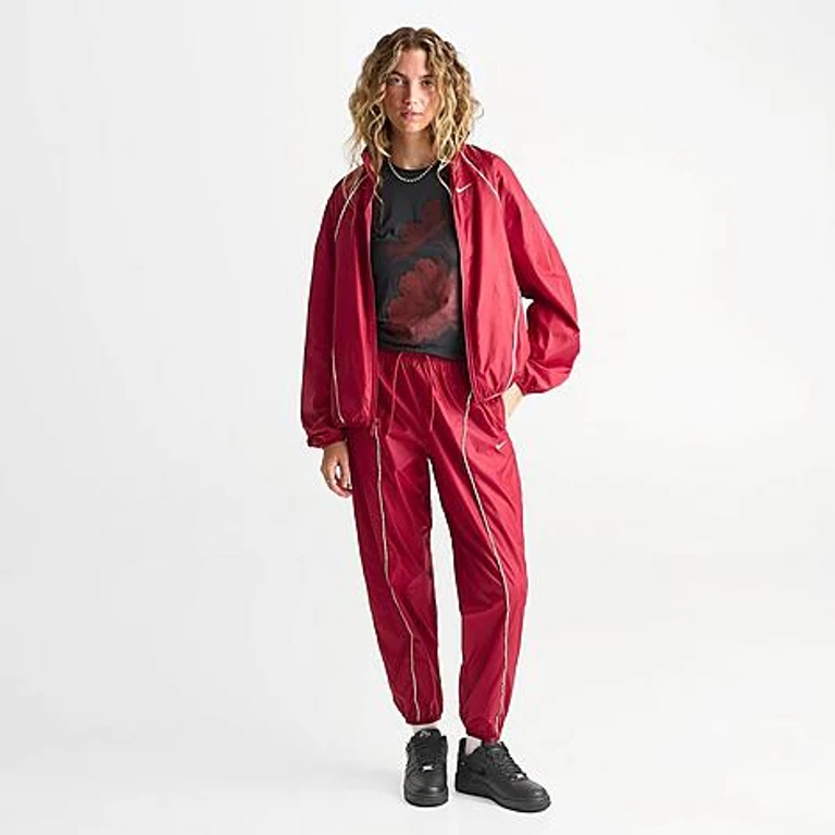 Nike Women's Sportswear Mid-Rise Repel Woven Pants in Tough Red/Sail/Sail Size: XS