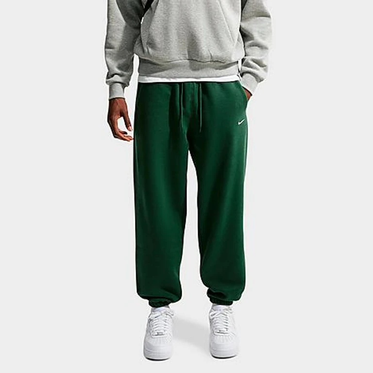 Nike Men's Solo Swoosh Cuffed Sweatpants in Fir/Sail Size: XS