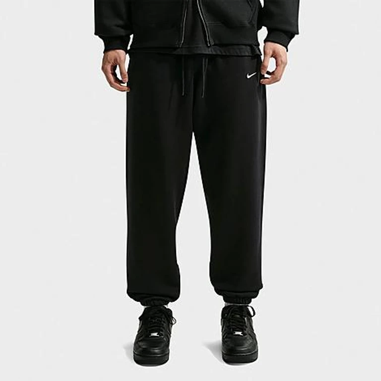 Nike Men's Solo Swoosh Cuffed Sweatpants in Black/Sail Size: Small